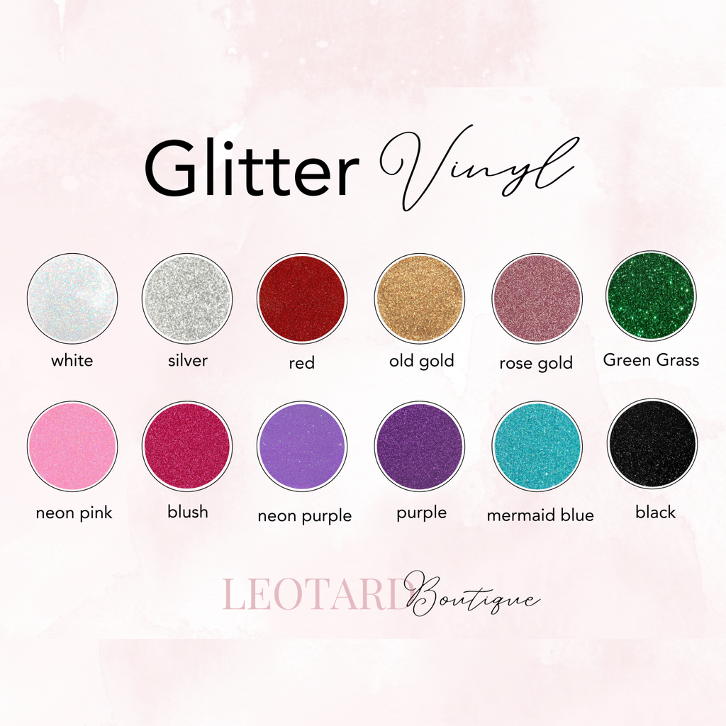 A display of various colors of glitter vinyl material. The vinyl is stacked on a white background with text labels identifying each color. The colors include white, silver, red, old gold, rose gold, green grass, neon pink, blush, neon purple, purple, mermaid blue, and black.
